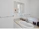 Bright bathroom with a single sink vanity and minimalist design at 857 Pawnee Trl, Castle Rock, CO 80108