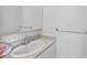 Bright bathroom featuring a sleek white sink with modern fixtures and a large mirror at 857 Pawnee Trl, Castle Rock, CO 80108