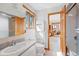 Bathroom featuring a window, wooden trim, shower, and vanity at 857 Pawnee Trl, Castle Rock, CO 80108