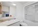 Bright bathroom featuring a tub/shower combo, toilet, and vanity with sink at 857 Pawnee Trl, Castle Rock, CO 80108