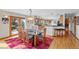 Open-concept dining room featuring hardwood floors and access to a kitchen at 857 Pawnee Trl, Castle Rock, CO 80108