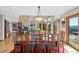 Dining area with a glass table and seating for eight with great views at 857 Pawnee Trl, Castle Rock, CO 80108