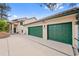 Wide view of the property showcasing the 3-car garage and well-maintained driveway at 857 Pawnee Trl, Castle Rock, CO 80108