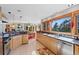Open kitchen and dining area with granite countertops, stainless appliances and views at 857 Pawnee Trl, Castle Rock, CO 80108