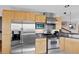 The kitchen is equipped with stainless steel appliances and ample cabinet space at 857 Pawnee Trl, Castle Rock, CO 80108