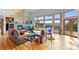 Cozy living area with a stone fireplace and panoramic views through large windows at 857 Pawnee Trl, Castle Rock, CO 80108
