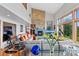 Bright living room with stone fireplace, high ceilings and large windows with views at 857 Pawnee Trl, Castle Rock, CO 80108