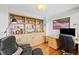 Office features built-in shelving and cabinets with a desk and comfortable chair at 857 Pawnee Trl, Castle Rock, CO 80108