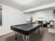 Finished basement with a pool table and a seating area in background at 11256 W 104Th Ave, Broomfield, CO 80021