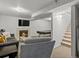 Finished basement with a fireplace, pool table, seating, and a stairway at 11256 W 104Th Ave, Broomfield, CO 80021