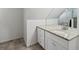 A bright vanity area features granite counters, tile floors and bright cabinets at 11256 W 104Th Ave, Broomfield, CO 80021