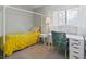 Cozy bedroom with canopy bed, decorative chair, and a bright window view at 11256 W 104Th Ave, Broomfield, CO 80021
