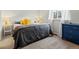 Relaxing bedroom with bright natural light, carpet, and stylish navy dresser at 11256 W 104Th Ave, Broomfield, CO 80021