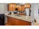 Updated kitchen with granite countertops, stainless steel appliances, and ample cabinet space at 11256 W 104Th Ave, Broomfield, CO 80021