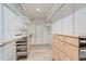Walk-in closet with custom shelving and drawers to maximize storage space at 7946 S Pennsylvania Ct, Littleton, CO 80122