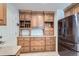 Spacious kitchen with custom cabinetry, granite counters, and stainless steel appliances at 7946 S Pennsylvania Ct, Littleton, CO 80122