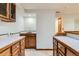 Finished basement featuring wet bar, ample storage and neutral decor at 7946 S Pennsylvania Ct, Littleton, CO 80122