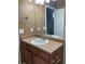 Bathroom vanity with a sink, a mirror, and a towel rack at 10457 W Hampden Ave # 104, Lakewood, CO 80227