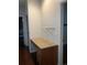A built-in desk area in a hallway niche with storage and a shelf above at 10457 W Hampden Ave # 104, Lakewood, CO 80227