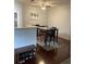 Dining area with a dark wooden table, chairs and seating bench, perfect for Gathering dinners at 10457 W Hampden Ave # 104, Lakewood, CO 80227