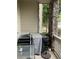 Covered outdoor patio with stone pillar and table with shade at 10457 W Hampden Ave # 104, Lakewood, CO 80227