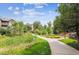 Scenic walking path winding through lush greenery near the condo complex, perfect for leisurely strolls and enjoying the outdoors at 10457 W Hampden Ave # 104, Lakewood, CO 80227