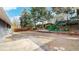 A spacious backyard with mature trees, offering a peaceful outdoor retreat at 3064 S Holly Pl, Denver, CO 80222
