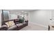 Bright basement featuring comfortable seating, accent pillows, and ample room for activities at 3064 S Holly Pl, Denver, CO 80222