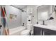 Modern bathroom featuring subway tile, a new vanity, and stylish fixtures at 3064 S Holly Pl, Denver, CO 80222