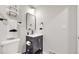 Cozy bathroom with new fixtures and a dark vanity at 3064 S Holly Pl, Denver, CO 80222
