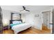 Bright bedroom with hardwood floors and a ceiling fan at 3064 S Holly Pl, Denver, CO 80222