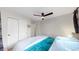 Bedroom with a closet, ceiling fan and comfortable bed at 3064 S Holly Pl, Denver, CO 80222