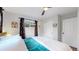 Bedroom with a closet, bright window and comfortable bed at 3064 S Holly Pl, Denver, CO 80222