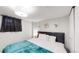 Serene bedroom with soft lighting, a comfortable bed, and closet space at 3064 S Holly Pl, Denver, CO 80222