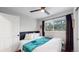 Cozy bedroom with a ceiling fan, bright window, and comfortable bed at 3064 S Holly Pl, Denver, CO 80222