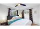 Bedroom featuring natural light from dual windows and stylish curtains at 3064 S Holly Pl, Denver, CO 80222
