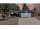 Charming home with a two-car garage, well-maintained landscaping, and a welcoming driveway at 3064 S Holly Pl, Denver, CO 80222