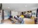 Open-concept layout seamlessly connects the living room and kitchen area at 3064 S Holly Pl, Denver, CO 80222