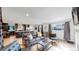 Bright living space with hardwood floors, modern furnishings, and ample natural light at 3064 S Holly Pl, Denver, CO 80222
