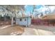 Backyard shed on a gravel base surrounded by a wooden fence, offering practical storage and utility space at 3064 S Holly Pl, Denver, CO 80222