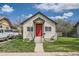 Quaint home with a red door, a small front yard, and sidewalk access at 1746 Galena St, Aurora, CO 80010