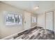 Bright entry area with wood-look flooring, white door and trim, and natural light at 1746 Galena St, Aurora, CO 80010