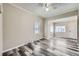 Spacious living area with neutral tones, wood-look floors, and ample natural light at 1746 Galena St, Aurora, CO 80010