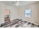 Light-filled living room features wood-look flooring, neutral colors, and updated lighting at 1746 Galena St, Aurora, CO 80010