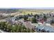 Aerial view of homes in a neighborhood, showcasing their rooftops and surroundings at 14820 E Maplewood Dr, Centennial, CO 80016