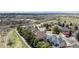 Scenic aerial view showcasing a neighborhood with lush greenery, winding paths, and varied home styles at 14820 E Maplewood Dr, Centennial, CO 80016