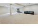 Spacious finished basement area featuring neutral carpet, exercise equipment, and comfortable seating at 14820 E Maplewood Dr, Centennial, CO 80016