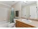 Well-maintained bathroom featuring a shower-tub combination, vanity, and fresh decor at 14820 E Maplewood Dr, Centennial, CO 80016