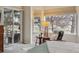 Sunlit bedroom featuring a cozy seating area with large windows and tranquil views at 14820 E Maplewood Dr, Centennial, CO 80016