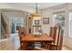 Formal dining room with hardwood floors, traditional furnishings and lots of natural light at 14820 E Maplewood Dr, Centennial, CO 80016